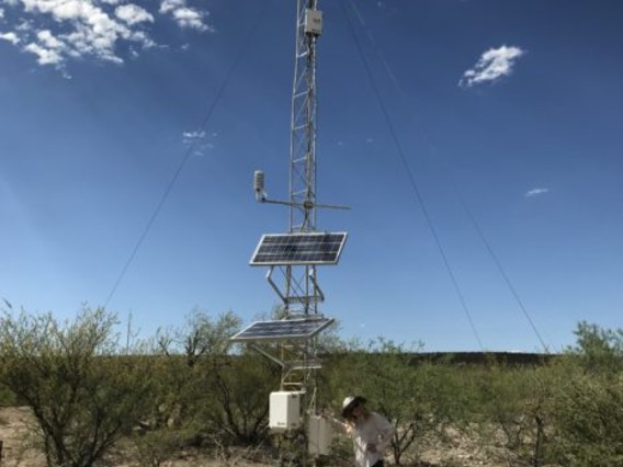 Ruby O'Brien Metzger poses with dust detection device