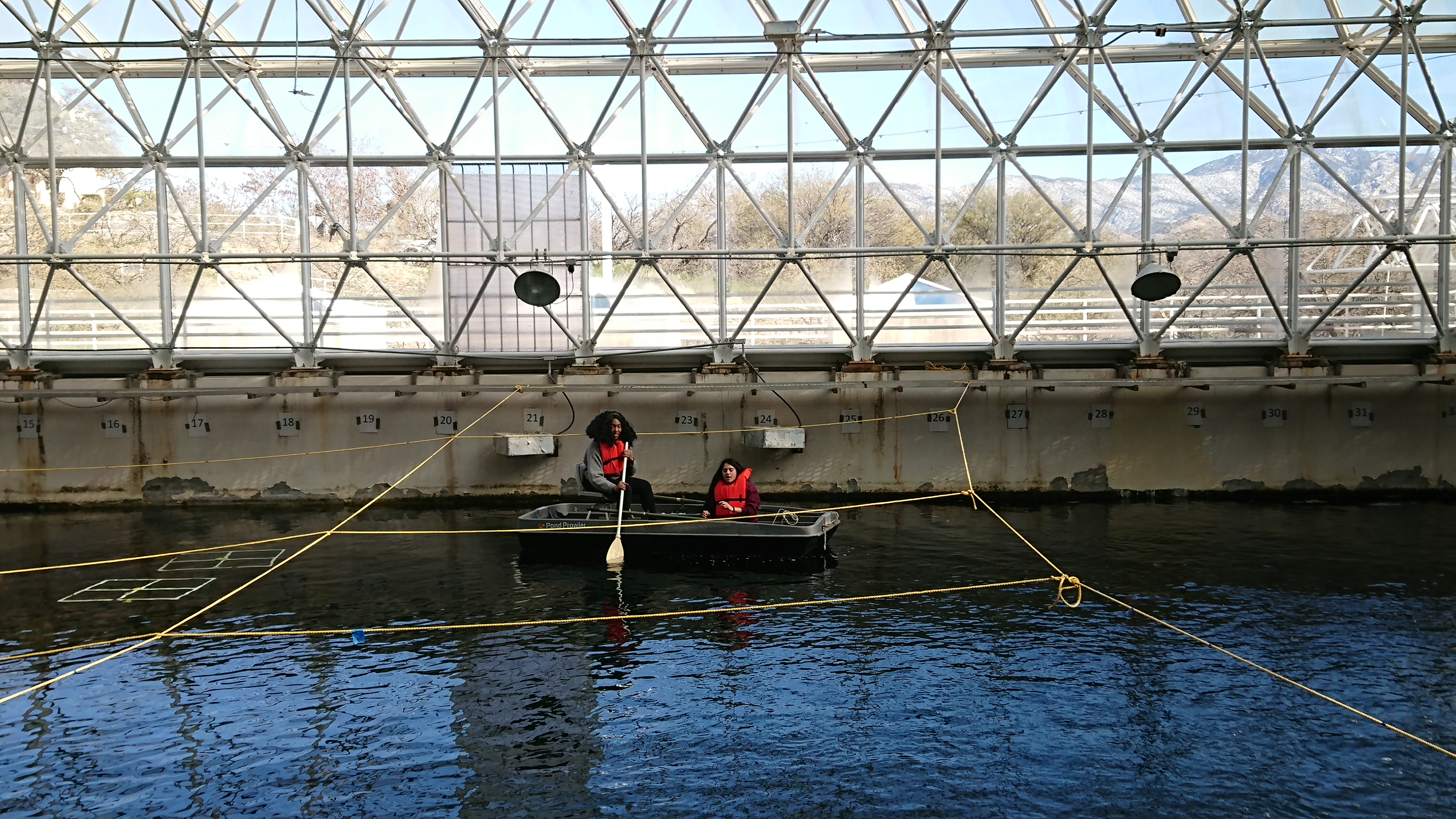 Cathryn Sephus and Alexus Cazares in a boat on the ocean at Biosphere 2