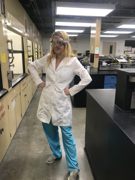 Ruby O'Brien-Metzger poses in the Superfund Dust Lab.