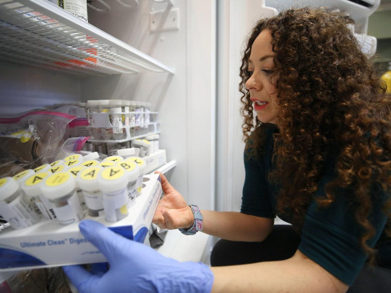 Mónica Ramírez-Andreotta, an assistant professor at the University of Arizona in the College of Agriculture and Life Sciences, shows samples of rainwater that were collected by citizens in parts of California and Arizona as part of Project Harvest.