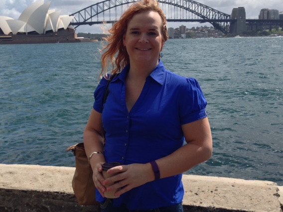 Portrait of Danielle Adams with bridge to Sydney Opera House.