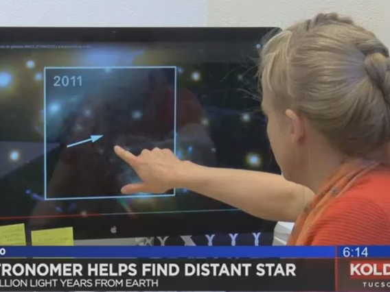 Brenda Fry points out the location of newly discovered star on a computer screen.