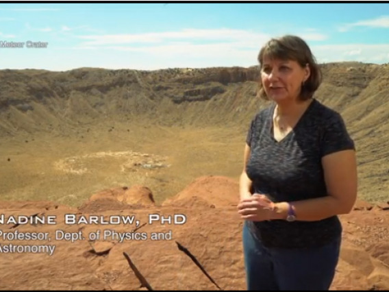 Nadine Barlow stands on the edge of Meteor Crater, AZ.