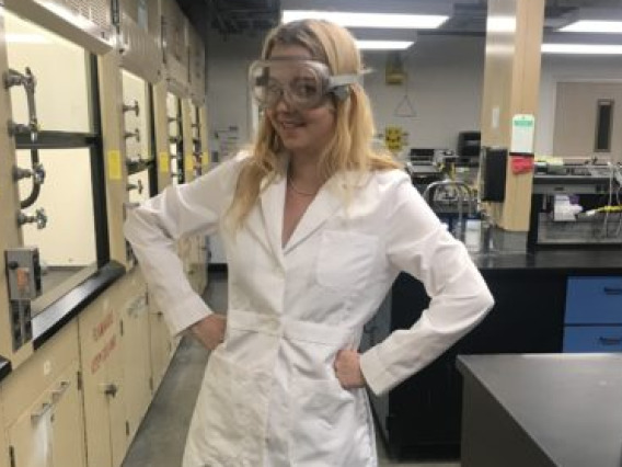 Ruby O'Brien-Metzger poses in the Superfund Dust Lab.