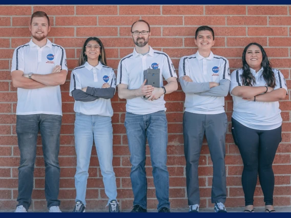 Group of 5 students on the Space Force team against brick background.