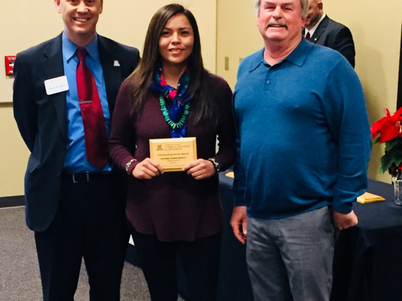 Rayanna Benally holds SNRE's Fall 2017 Outstanding Graduating Senior Award, with her mentor Steven Archer,  and Shane Burgess - Dean of College of Agriculture and Life Sciences