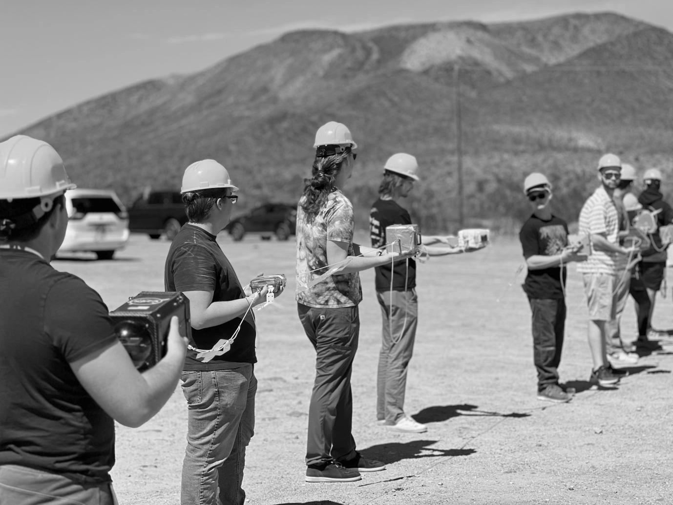 ASCEND students hold their payloads, which are tied onto a string tethered to the high-altitude weather balloon.