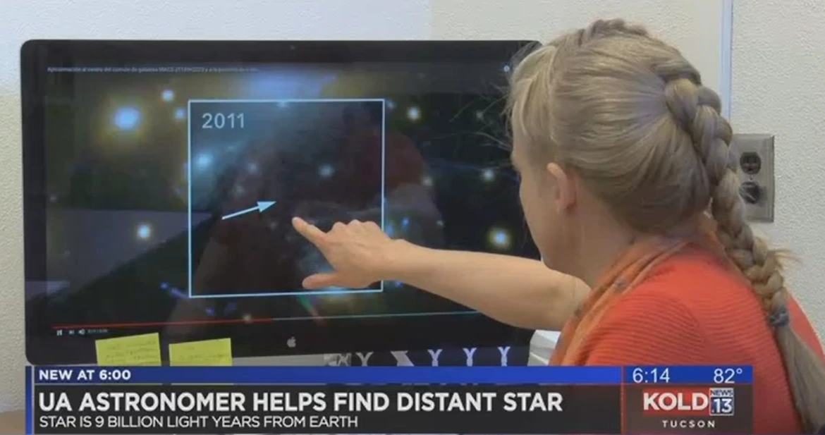 Brenda Fry points out the location of newly discovered star on a computer screen.