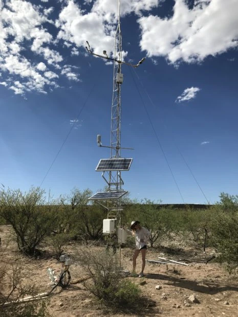 Ruby O'Brien Metzger poses with dust detection device