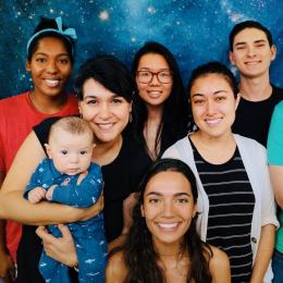 Portrait of Betul Kacar with her child and her laboratory team
