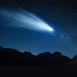 An artist illustration of what centaur SW1 would look like if it became an inner solar system Jupiter-Family comet at a distance of 0.2 AU (19 million miles) from Earth. The moon is in the upper right part of the frame for scale. (Image: Heather Roper)